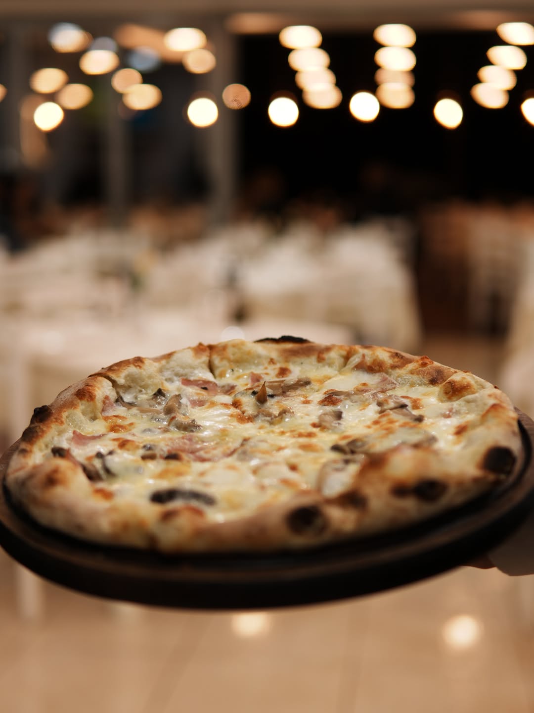 Wood-fired pizza at Guma Bar Restaurant